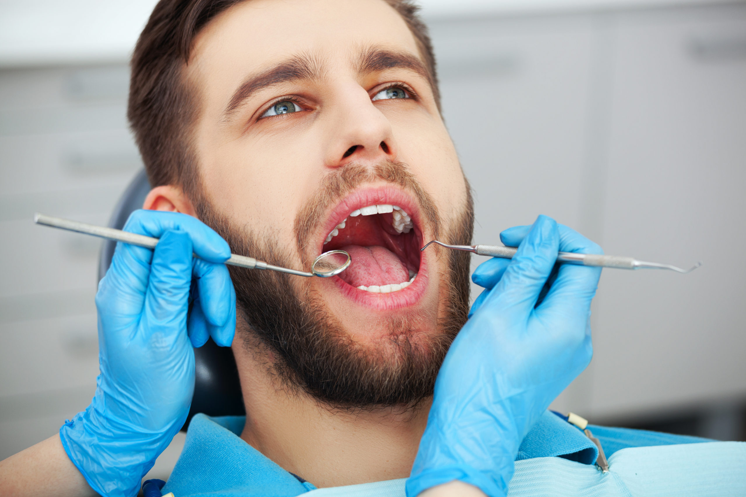 man getting teeth cleaned